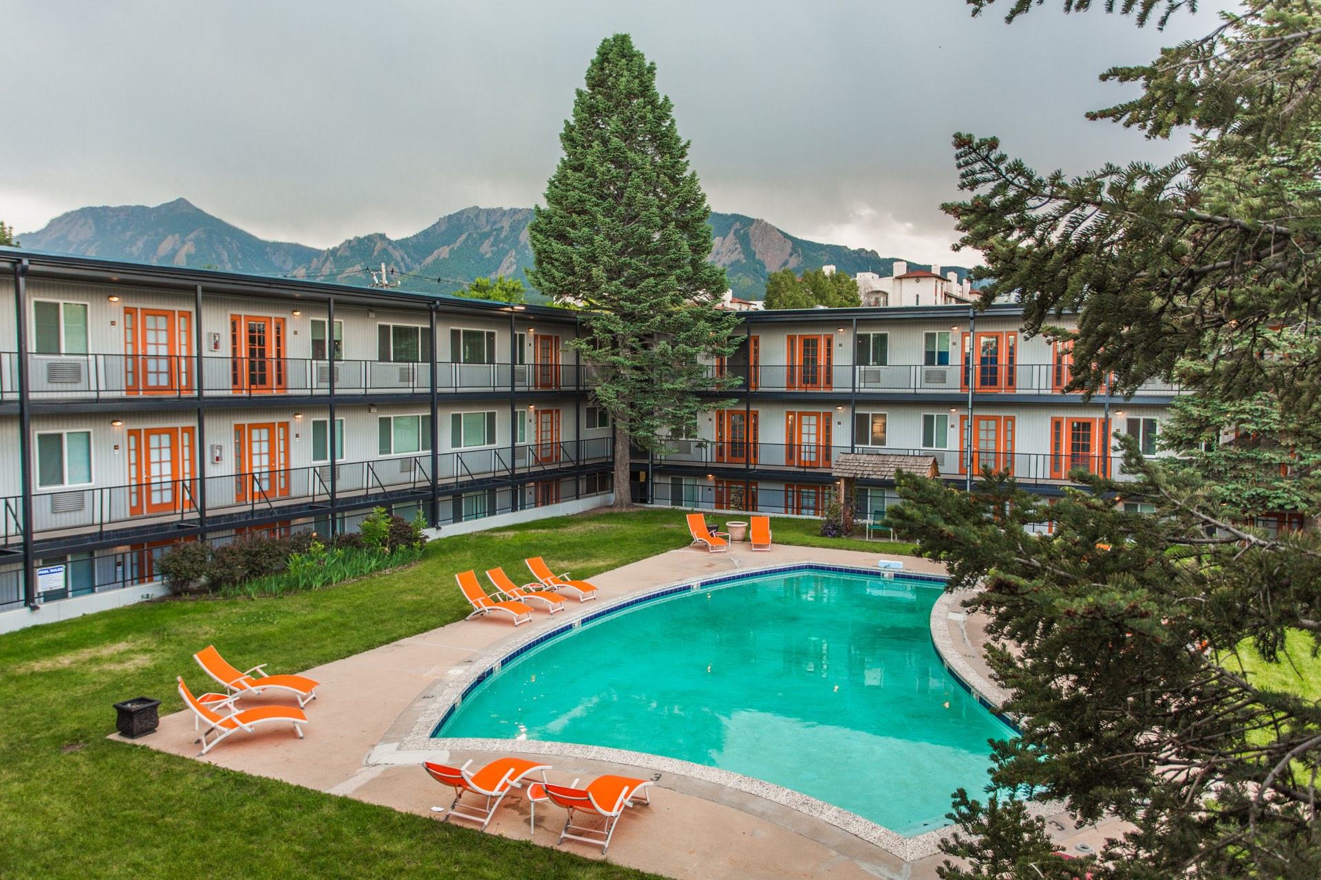 The Lodge courtyard pool beneath the Boulder Flatirons
